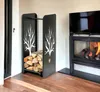 A modern living room with a fireplace and a black metal firewood rack filled with logs. Podgląd zdjęcia produktu