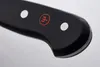 A close-up shot of the handle of a knife. Voir les images du produit