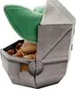 A plush toy of Baby Yoda in its pram. Produktbild-Vorschau