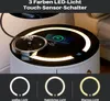 A close-up of a modern nightstand with a glowing LED light ring and a smartphone charging on its surface. Below the nightstand, three circular icons illustrate different light color options. Voir les images du produit