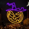 A neon sign of a pumpkin wearing a witch's hat, set against a dark background with a crescent moon and decorative lights. Produktbild-Vorschau