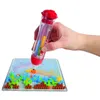 A hand holding a bead applicator tool and creating a design on a pegboard with colorful beads. Náhled obrázku produktu