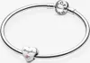A silver Pandora bracelet with a heart-shaped charm engraved with 'Daughter' and a small pink stone. Podgląd zdjęcia produktu