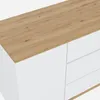 A close-up view of the top corner of a white sideboard with a wooden top. Anteprima dell’immagine prodotto