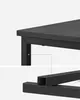 Close-up of a black table leg and frame structure, with a diagrammatic line connecting them. Náhled obrázku produktu