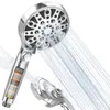 A chrome-finished shower head with multiple spray settings, shown with water spraying from it. Another part of the shower head is visible in the foreground. Produktbild-Vorschau