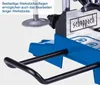 Close-up of a blue and silver machine with black handles, featuring a logo and text. Produktbild-Vorschau