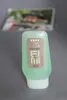 A bottle of Wella Eimi Sculpt Force Extra Strong Flubber Gel is shown on a gray surface with a blurred photograph in the background. Náhľad obrázku produktu