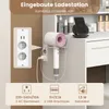 Close-up of a vanity table with a built-in charging station, featuring a hairdryer and a phone charging on a wireless charger. Voir les images du produit