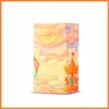 A product box with a carnival theme and candy-like clouds. Produktbild-Vorschau