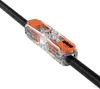 A close-up studio shot of a WAGO 221-2411 lever connector with a black wire passing through it, set against a white background. Anteprima dell’immagine prodotto