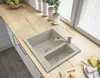 A kitchen sink with a faucet on a wooden countertop, with decorative vases and blinds in the background. Anteprima dell’immagine prodotto