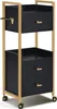 A black and gold rolling cart with drawers. Produktbild-Vorschau