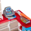A toy cash register and scale with a toy carrot. Náhled obrázku produktu