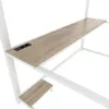 A close-up view of a white metal frame bunk bed with a wooden desk surface and integrated power outlets. Produktbild-Vorschau