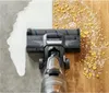 A vacuum cleaner head is shown cleaning a floor with both liquid and dry debris. Voir les images du produit