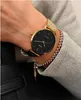 A close-up shot of a person's wrist wearing a gold Casio watch and a beaded bracelet. Produktbild-Vorschau
