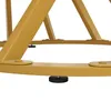 A close-up view of the base of a table, showing the golden metal legs and adjustable feet. Voir les images du produit