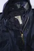 Close-up view of the inside collar and zipper area of a navy blue parka jacket. Náhled obrázku produktu