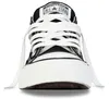 A close-up, front-facing view of a black Converse All Star sneaker with white laces. Voir les images du produit