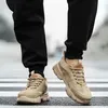 A person wearing black pants and tan sneakers walks on a crosswalk. Produktbild-Vorschau