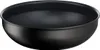 A black wok pan shown from a slightly elevated side angle against a white background. Voir les images du produit