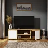 A modern living room with a TV stand, TV, and decorative items. Náhled obrázku produktu