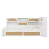 A white daybed with storage drawers and shelving units. Voir les images du produit