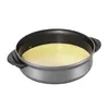 A close-up shot of a TEFAL electric wok and fondue pot filled with a yellow liquid. Produktbild-Vorschau