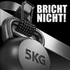 Close-up of a black kettlebell with '5KG' embossed on it, attached to a silver strap by a braided black cord. Text 'BRICHT NICHT!' is in white on the black background. Produktbild-Vorschau