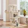 A multi-level cat tree with several cats interacting with it, placed near a window with a plant. Podgląd zdjęcia produktu