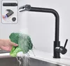 A black kitchen faucet is shown in use, washing a head of broccoli under running water. An inset diagram shows a close-up of the faucet head and its spray functions. Náhled obrázku produktu