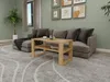 A living room scene with a couch, coffee table, and rug. Náhled obrázku produktu