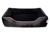 A black dog bed with white trim, shown from a front-facing angle on a white background. Produktbild-Vorschau
