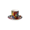 A colorful espresso cup and saucer set. Voir les images du produit