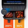 A close-up marketing image of a dual-zone air fryer showing food cooking in both zones, with text overlays highlighting a feature. Produktbild-Vorschau