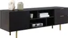 A black TV lowboard with gold metal legs and decorative items on top. Náhled obrázku produktu