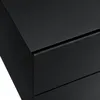 A close-up view of the corner of a black nightstand with two drawers. Anteprima dell’immagine prodotto