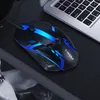 A gaming mouse with blue LED lights is placed on a black mousepad next to a laptop keyboard. Produktbild-Vorschau
