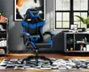 A gaming chair is shown in a room setting with bookshelves and a window. Produktbild-Vorschau