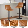 Two brown faux leather bar stools are shown in a modern interior setting, with close-up insets highlighting product features. Produktbild-Vorschau