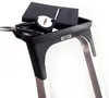 A close-up shot of a black tool tray attached to a silver ladder, holding various tools and a black notebook. Podgląd zdjęcia produktu