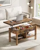 A lift-top coffee table with storage is shown in a living room setting, next to a sofa. Voir les images du produit