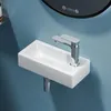 A close-up shot of a white rectangular sink with a chrome faucet mounted on a blue wall. Anteprima dell’immagine prodotto