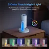 A night light is displayed on a bedside table, with different color options shown below. Produktbild-Vorschau