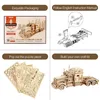 A collage of four images showing the packaging, assembly instructions, puzzle pieces, and a finished model of a heavy truck. Anteprima dell’immagine prodotto