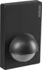 A black motion sensor mounted on a flat surface. Podgląd zdjęcia produktu