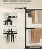 A close-up view of a black drying rack with towels hanging on it, with diagrams illustrating its features. Produktbild-Vorschau