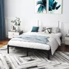 A bedroom scene with a bed frame, bedding, and decor. Náhľad obrázku produktu