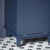 A close-up view of the bottom of a blue cabinet with a hexagonal tile floor. Náhled obrázku produktu